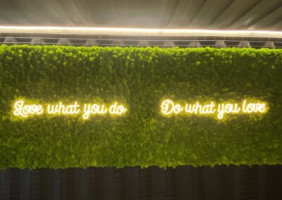 Attractive Fresh moss wall with lighted up logo | DGW Cafe